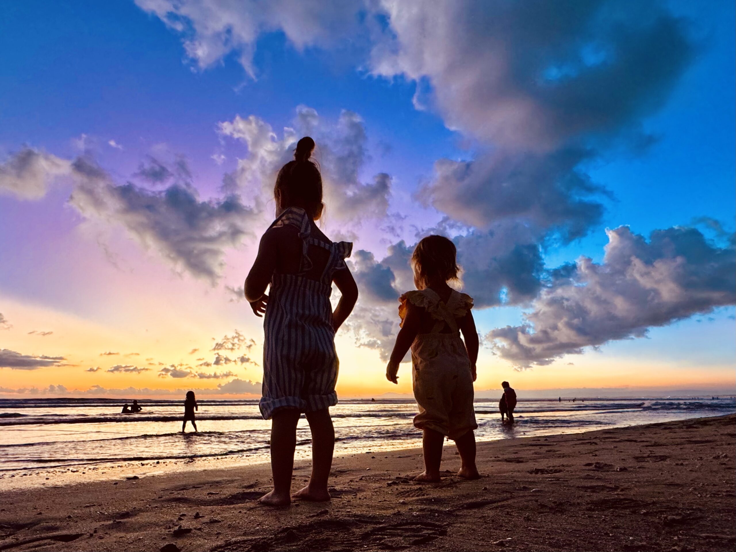 Kids watching sunset in Bali Indonesia