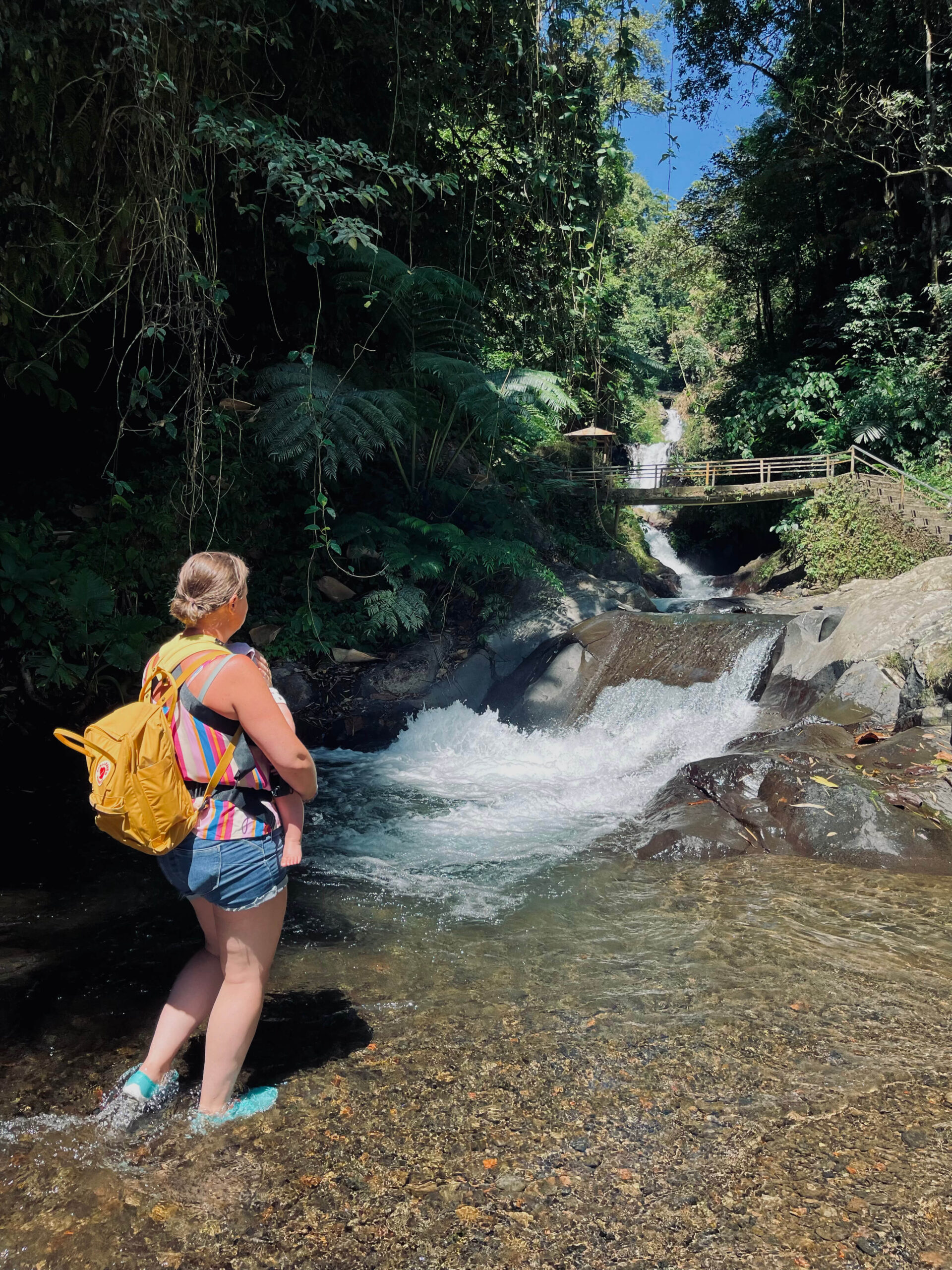 family visiting gitgit waterfall on vacation to Bali