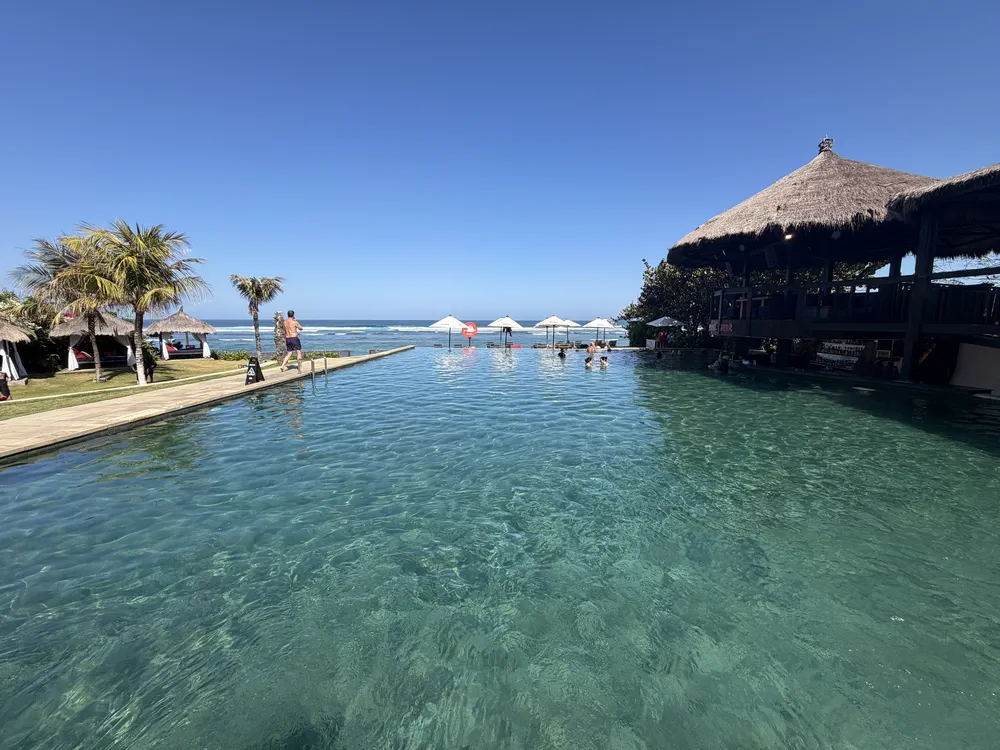 Our kids enjoying the swimming pool at Roosterfish Beach Club in Bali
