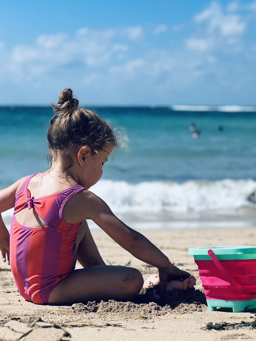 Toddler playing at Mengiat beach in Bali