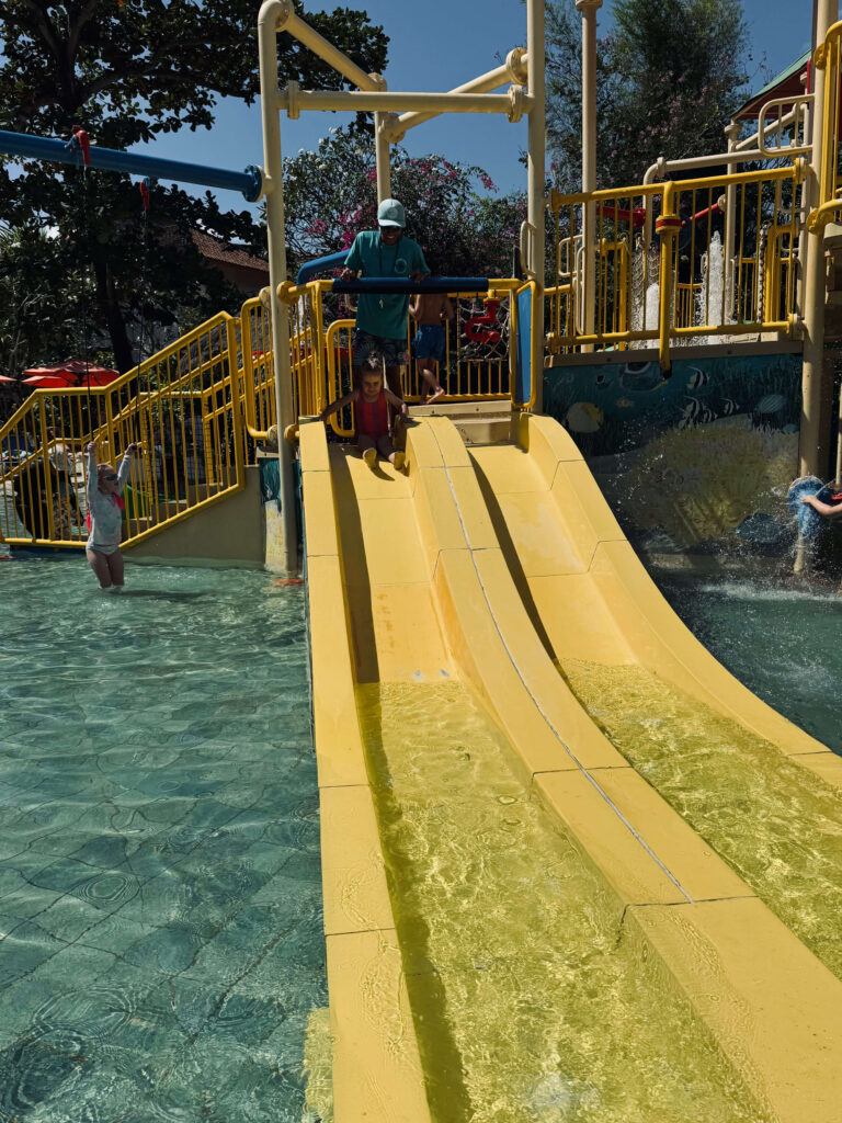 Kids enjoying waterslides in Waterbom Park in Bali