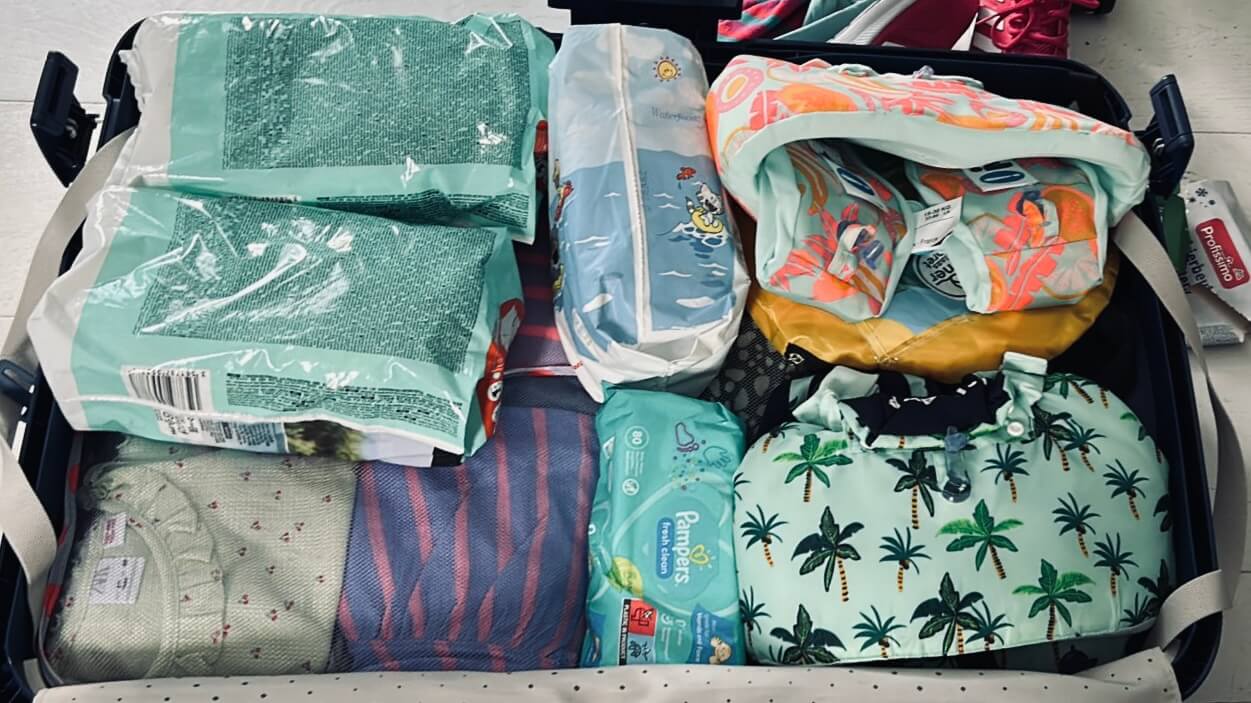 Packed travel backpack ready for a family trip to Thailand