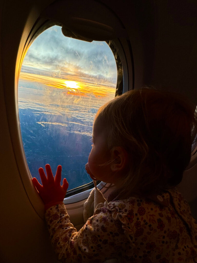 baby in airplane getting ready for sleep
