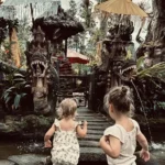 Our kids visitng a very small temple in Candidasa, Bali