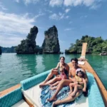 Family on a longtail boat during an island hopping tour in Thailand