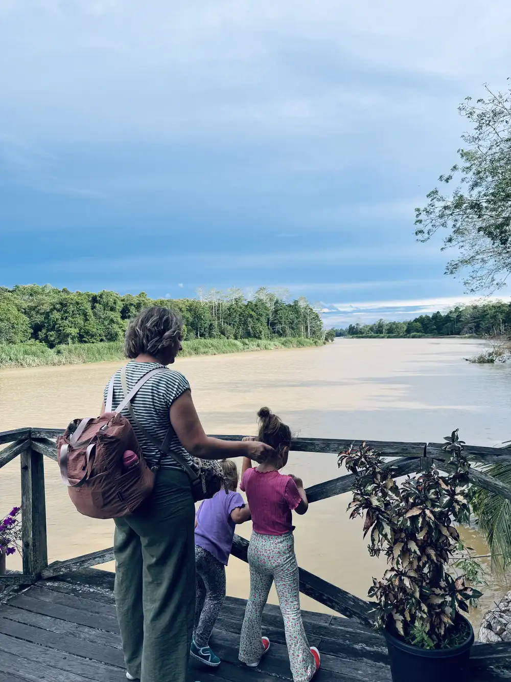 Family waiting for a tour on the Kinabatangan river