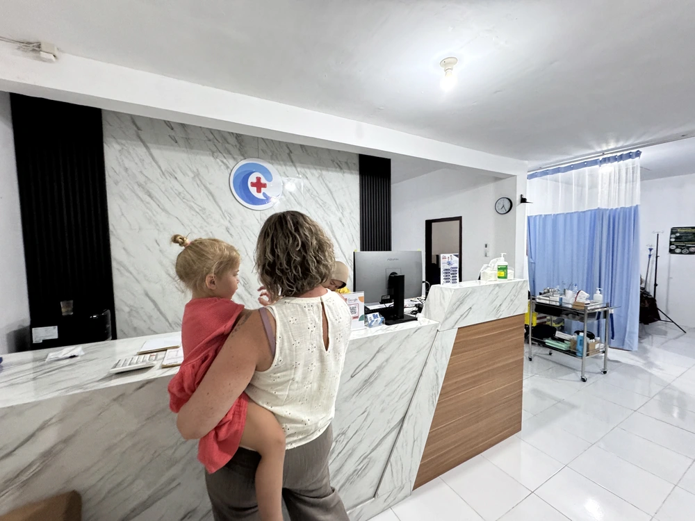 Family visiting a local clinic with a toddler