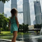 Child enjoying KLCC Park during a family trip to Kuala Lumpur with kids