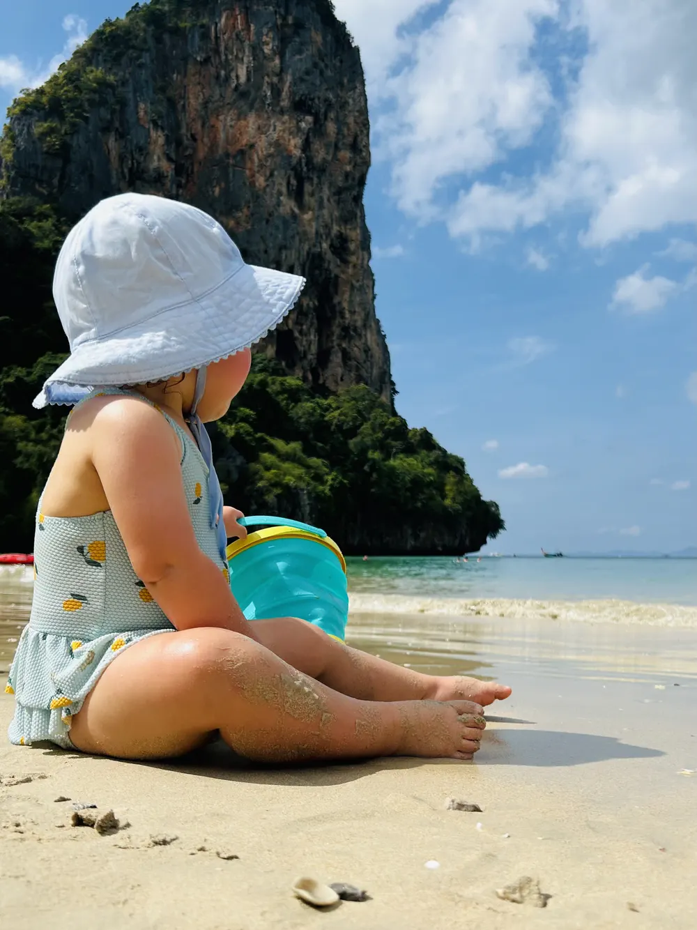 Baby playing at Railay beach, on a trip from Ao Nang
