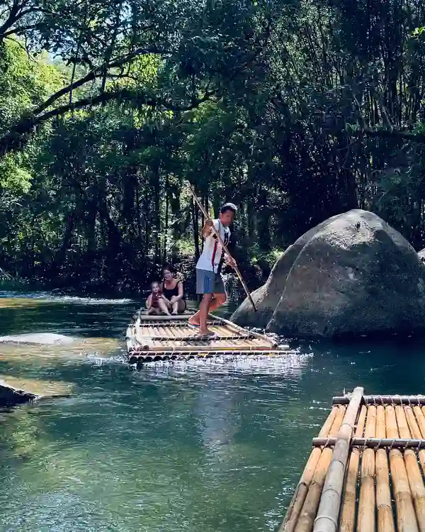 Family bamboo rafting with toddlers in Khao Lak, Thailand