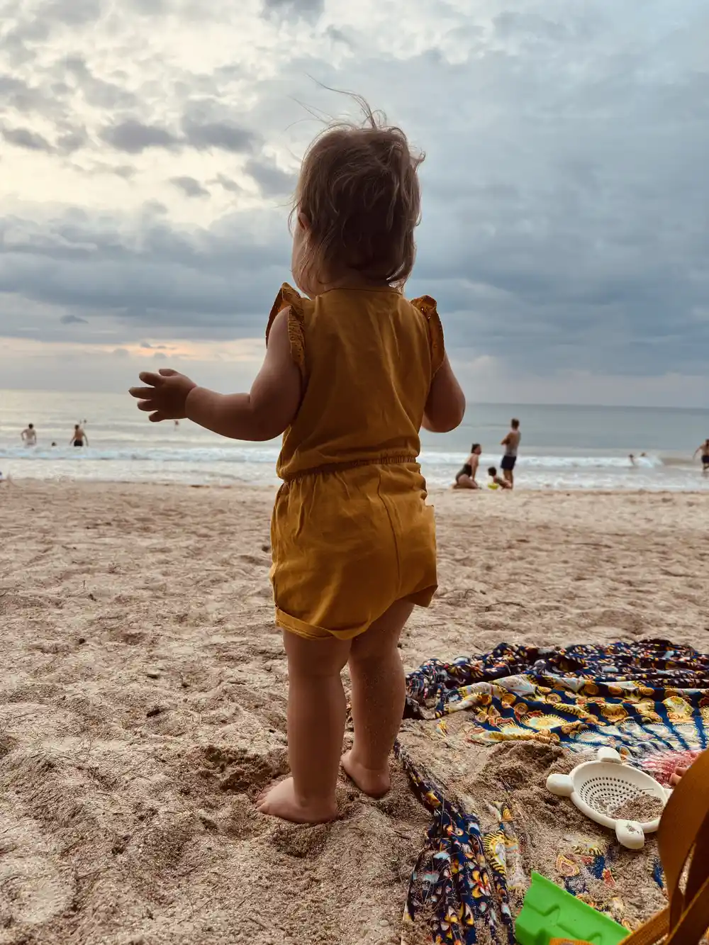Toddler playing on a beach in Phuket