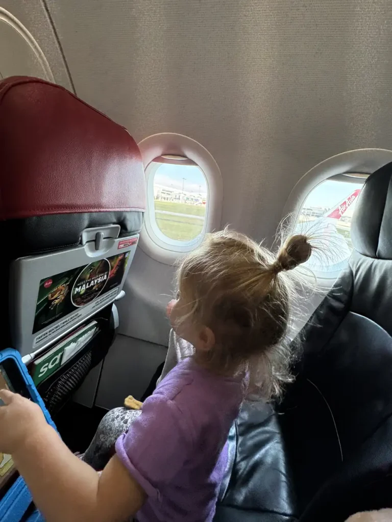 Toddler playing in airplane