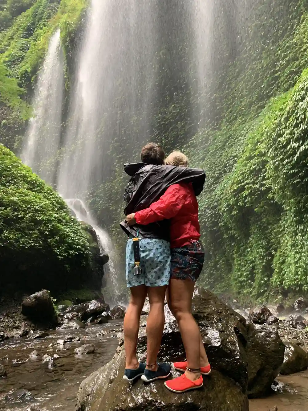 Parents at Madakaripura waterfall in East Java Indonesia