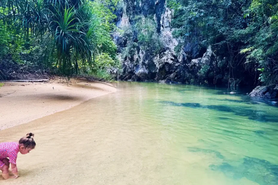 Child exploring a tropical lagoon during an island tour in Thailand