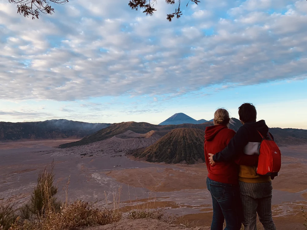 Parents at Mount Bromo volcano viewpoint Java Indonesia