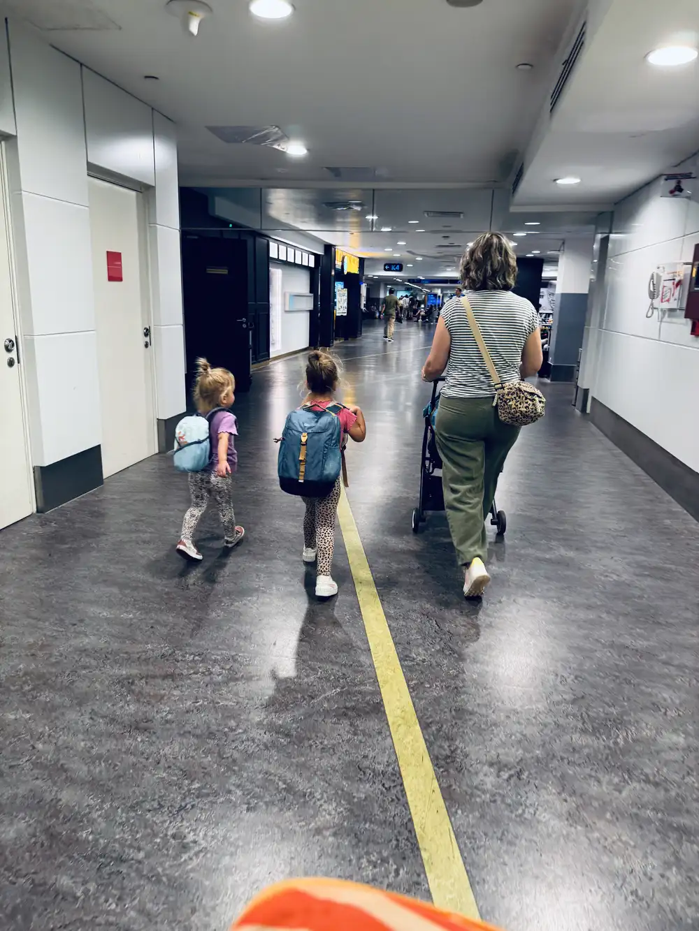Family taking a short walk on the airport