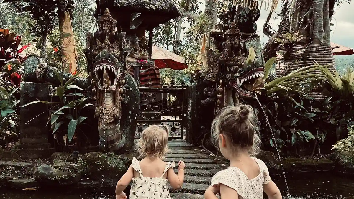 Children visiting a small temple in Ubud Bali family travel