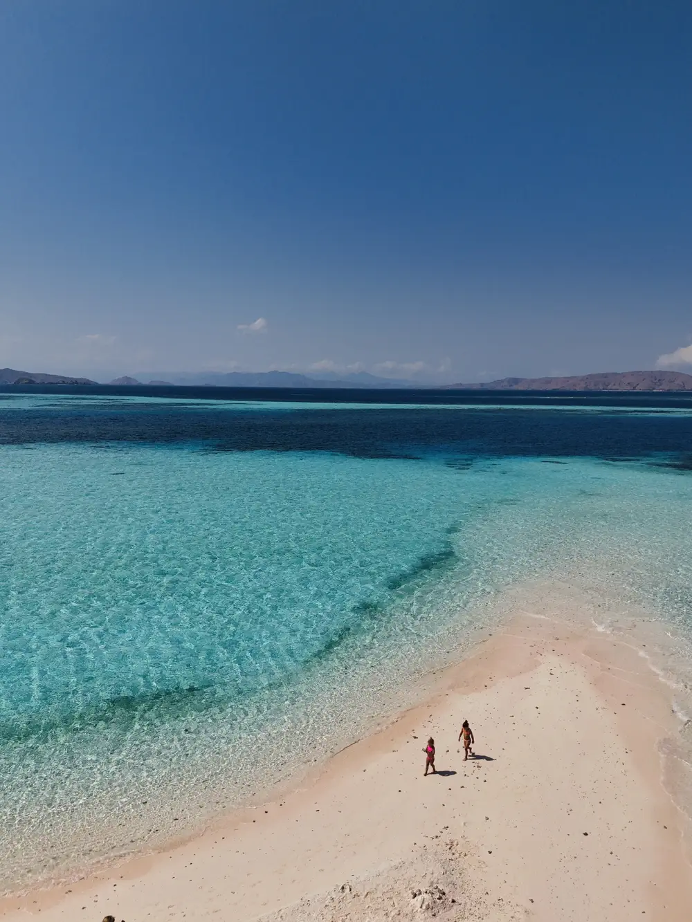 Children on the sandbank at Taka Makassar, Komodo National Park, Indonesia