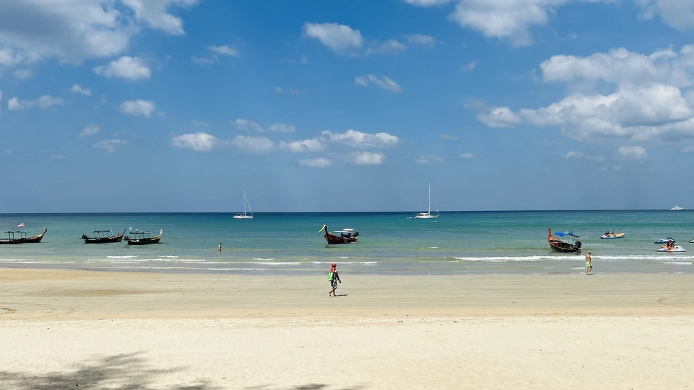 Wide beach at Bang Tao Phuket Thailand with space for children to play