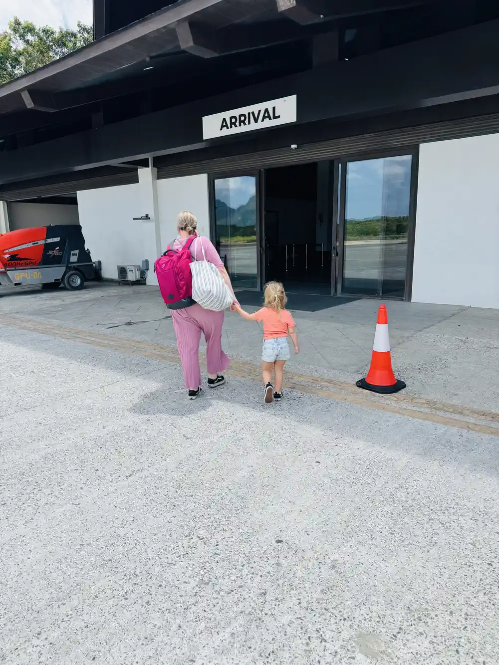 Family arriving at the airport after a long-haul flight