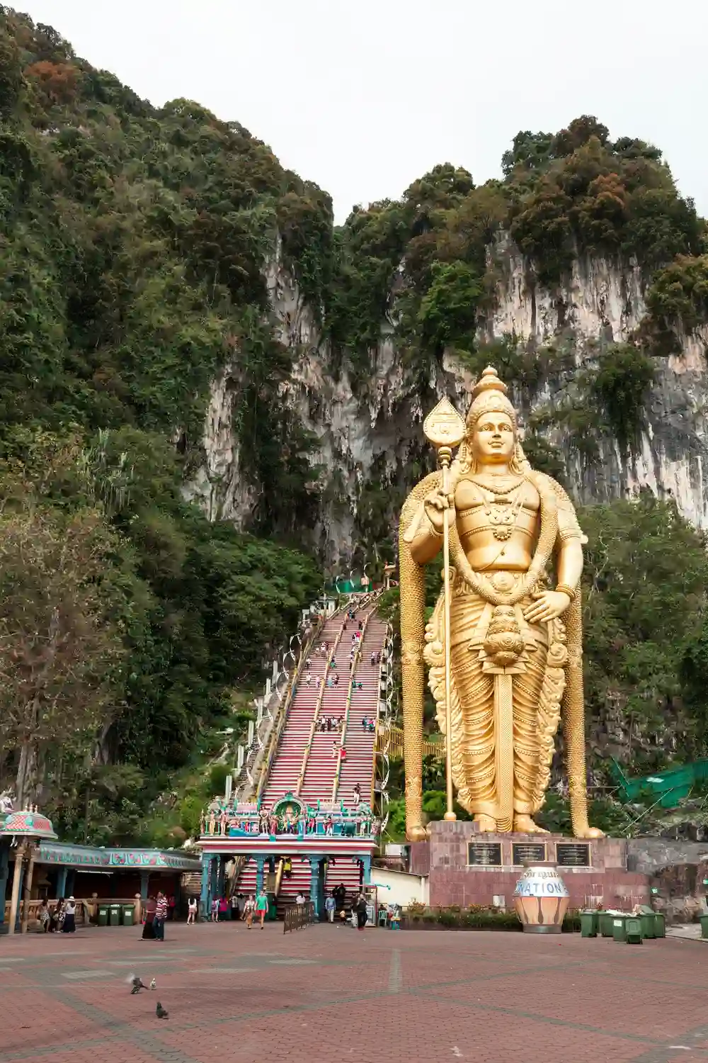 Colorful stairs and temple entrance at Batu Caves near Kuala Lumpur with kids