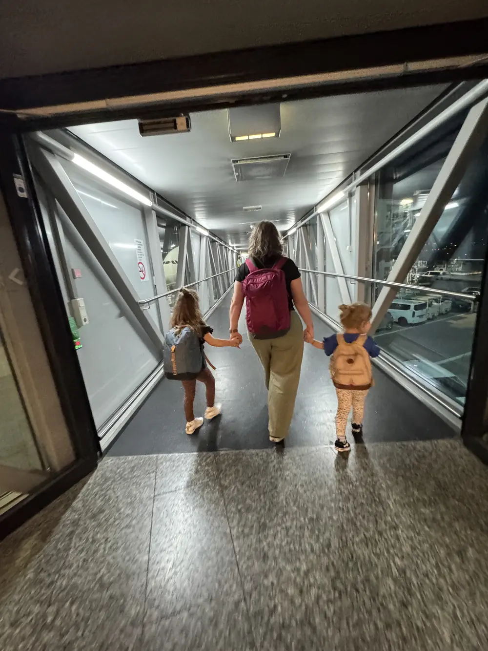 Family walking through the airport before boarding