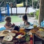 Sisters playing at a family-friendly play café in Uluwatu, Bali