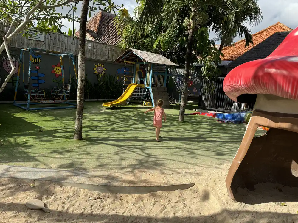 Child playing at The Cashew Tree playground in Uluwatu, Bali