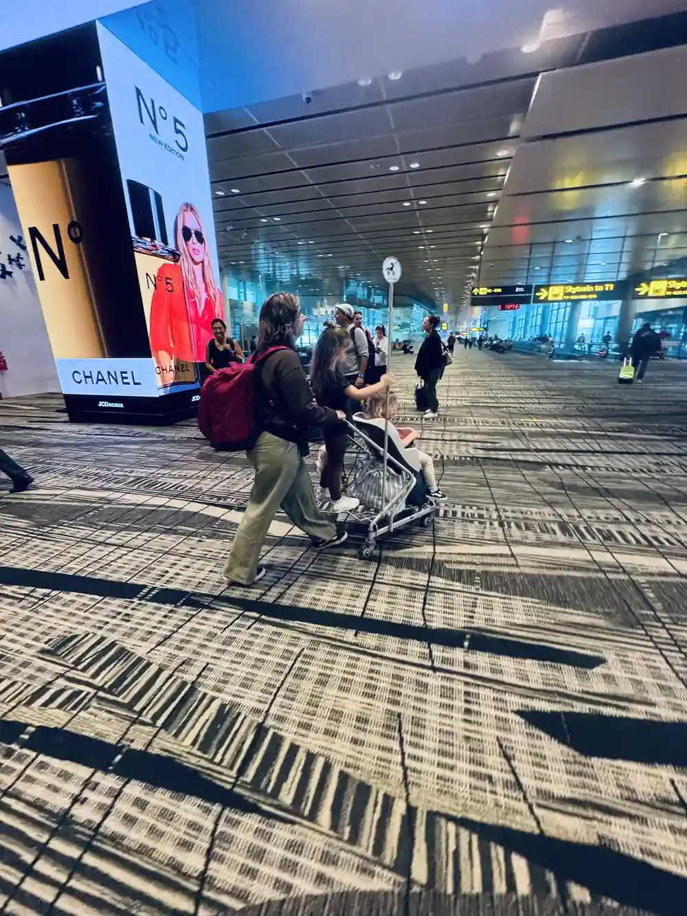 Family with stroller at Changi Airport in Singapore