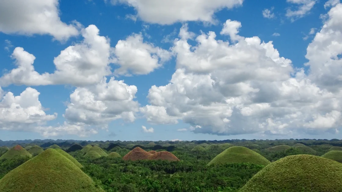 Family visiting the Chocolate Hills in Bohol with children