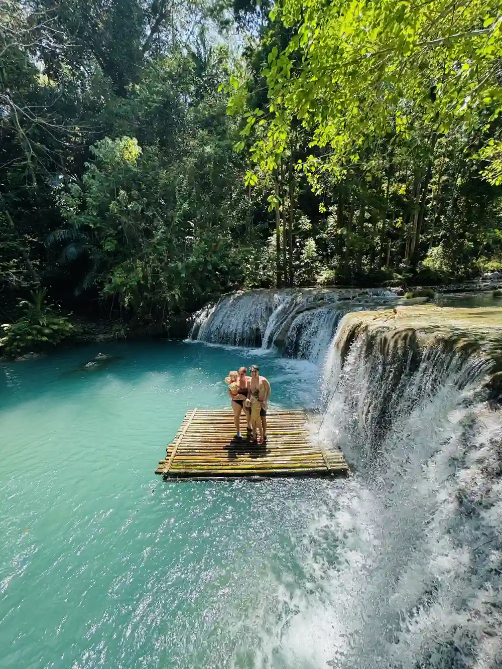 Family visiting a waterfall in Siquijor, Philippines