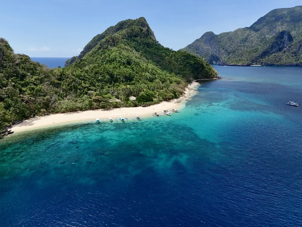 Drone view of Helicopter Island during an island-hopping tour in El Nido
