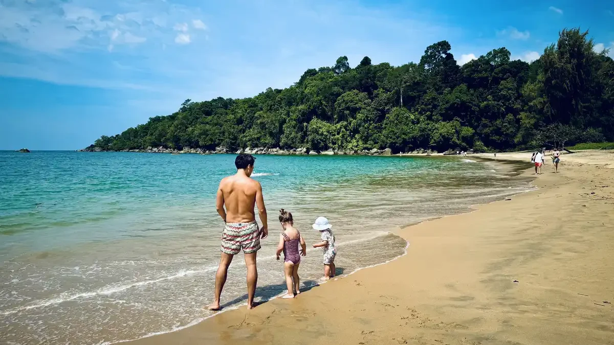 Family enjoying a beach day in Khao Lak, Thailand