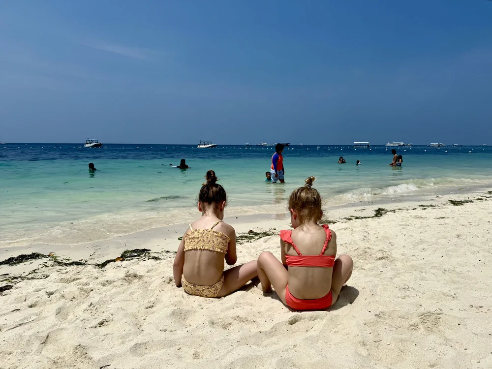 Children playing on a sunny beach in the Philippines