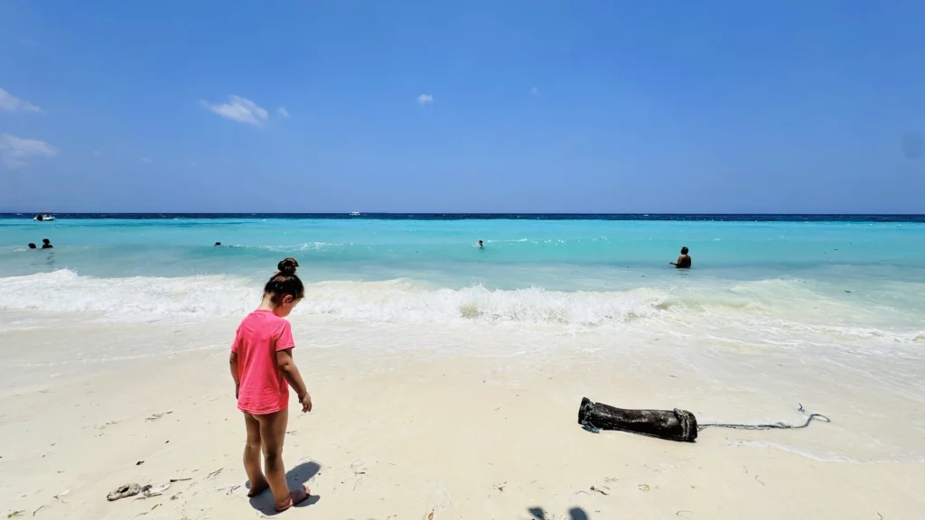 Daughter enjoying Dumaluan Beach in Bohol, Philippines, during a family vacation with kids