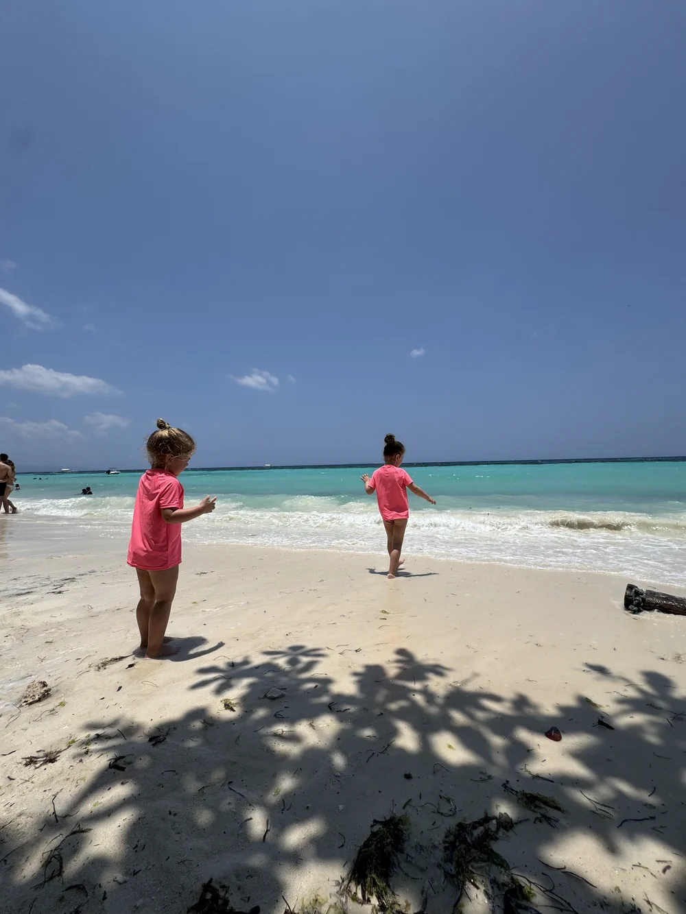 Children wearing rash guards on Panglao Beach in Bohol, Philippines