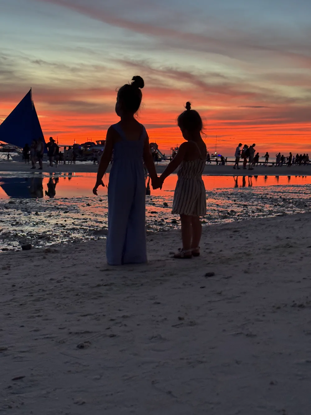 Our daughters watching the sunset on White Beach in Boracay