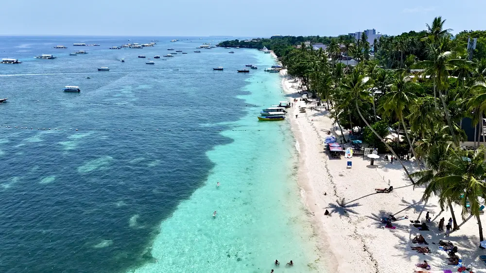 Aerial view of Alona Beach in Panglao, Bohol, with its white-sand beach and beachfront resorts
