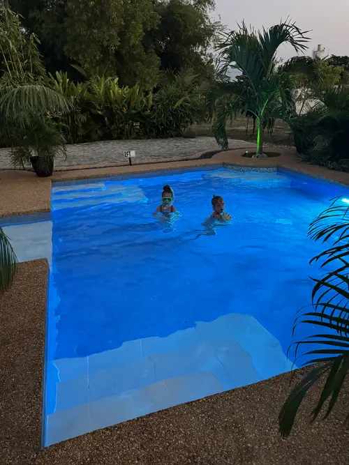 Our kids swimming in the pool at Buenacosa Resort in Panglao, Bohol