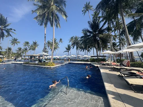 Kids swimming in the large pool at Henann Resort Alona Beach in Panglao, Bohol
