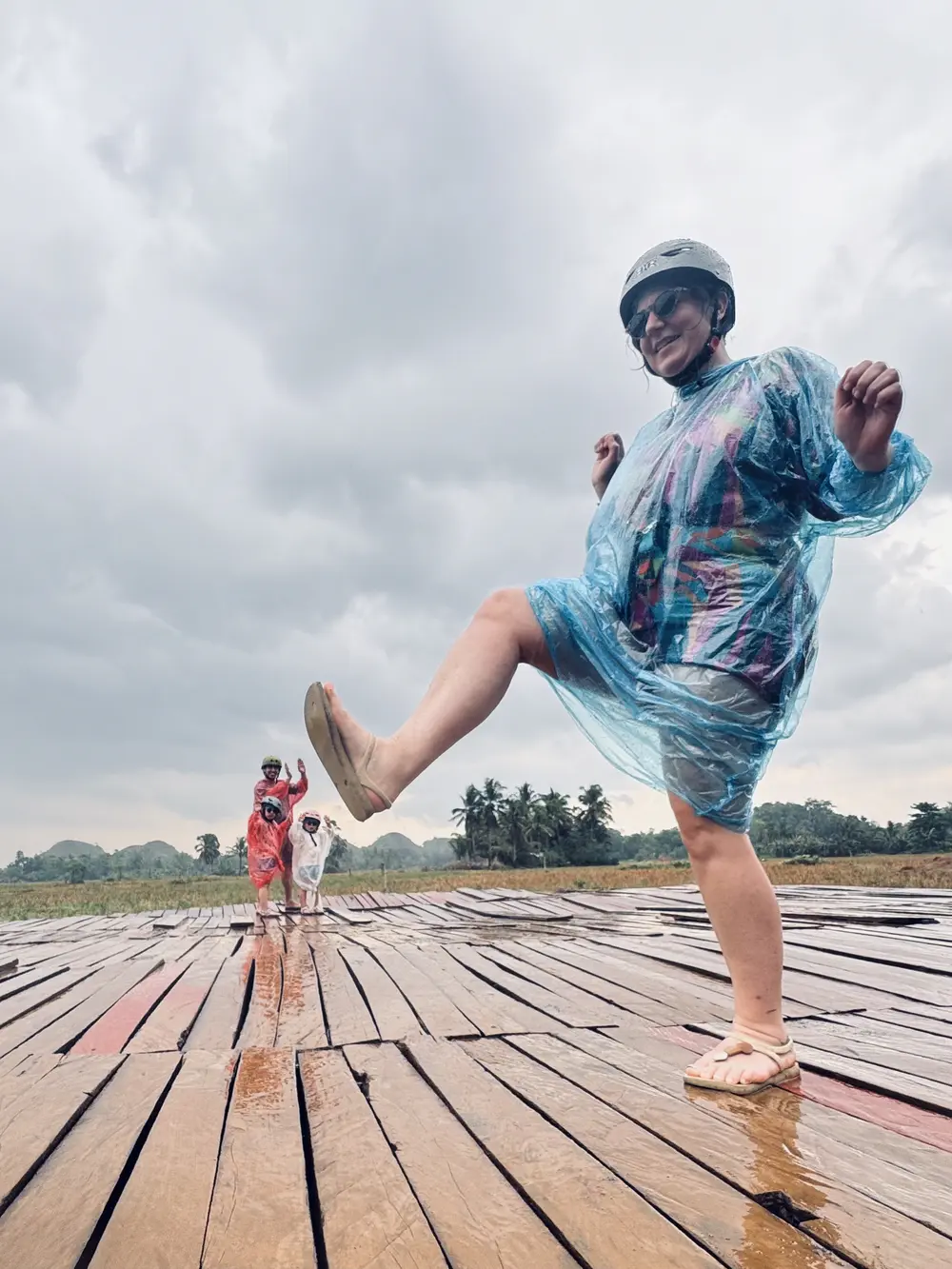 Our family in rain ponchos during a rainy day in Bohol