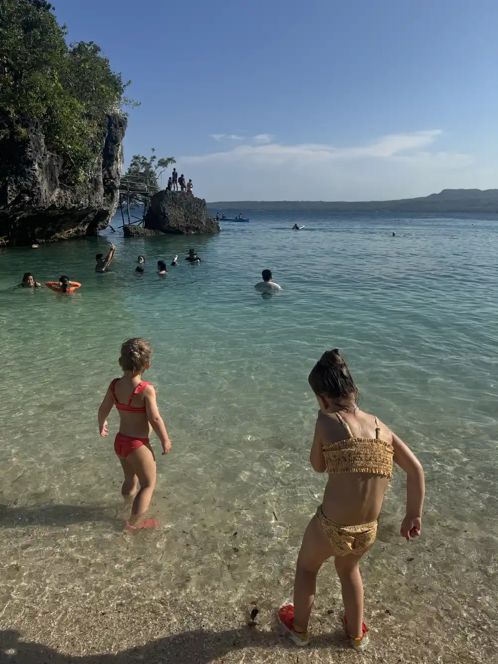 Toddlers wearing water shoes at Salagdoong Beach in Siquijor