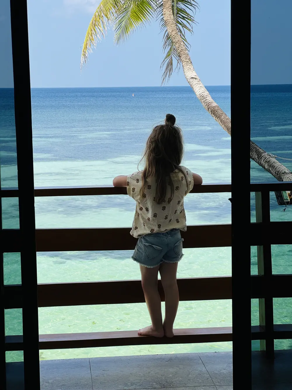 Girl looking out over the sea at Tropical Fun-Ta-Sea in Siquijor