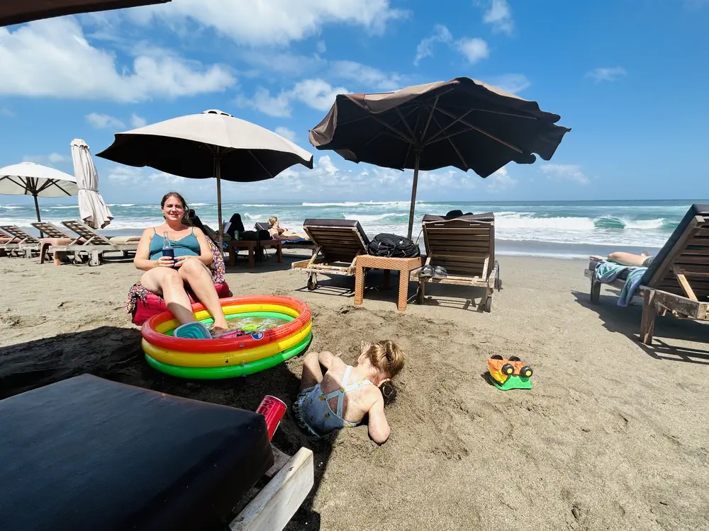 Kids playing in an inflatable pool on Canggu Beach, Bali