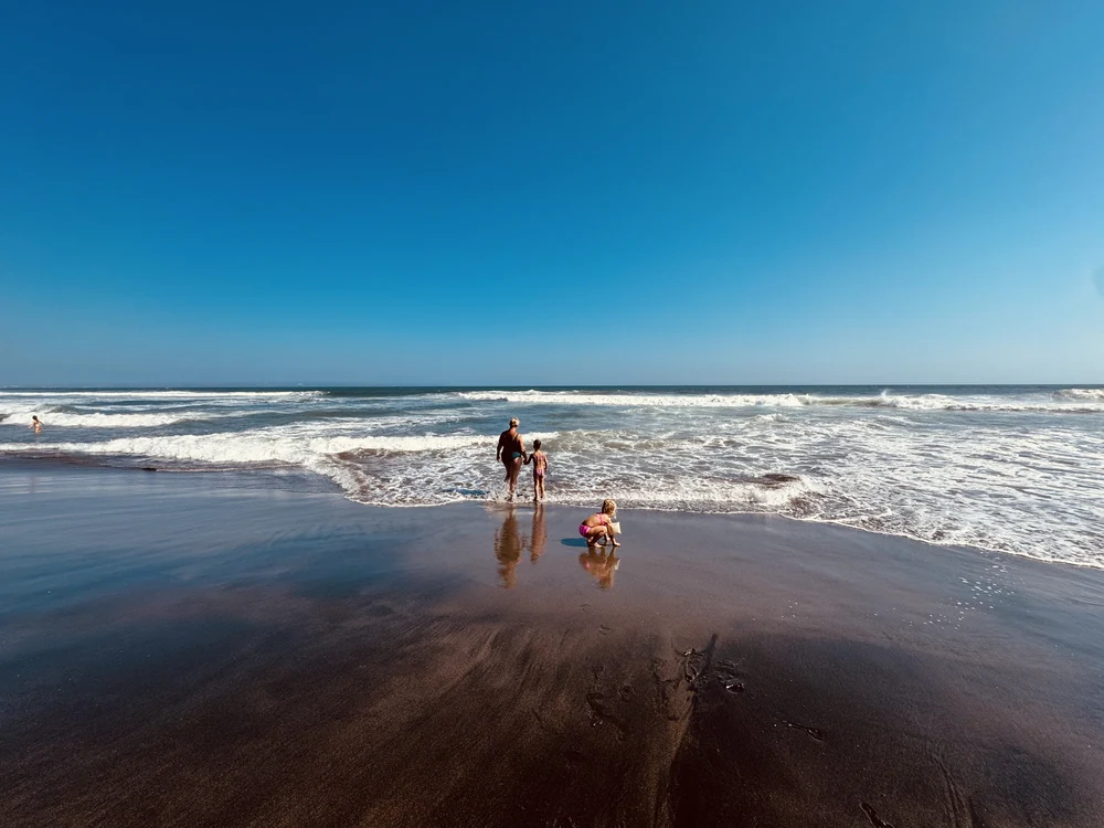 Our family on Canggu Beach near La Brisa during a family trip to Canggu with kids