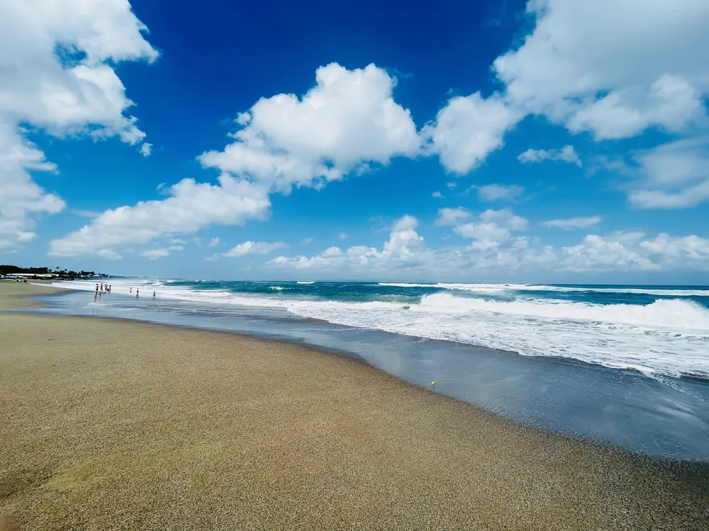 Canggu Beach in Bali with waves and black volcanic sand