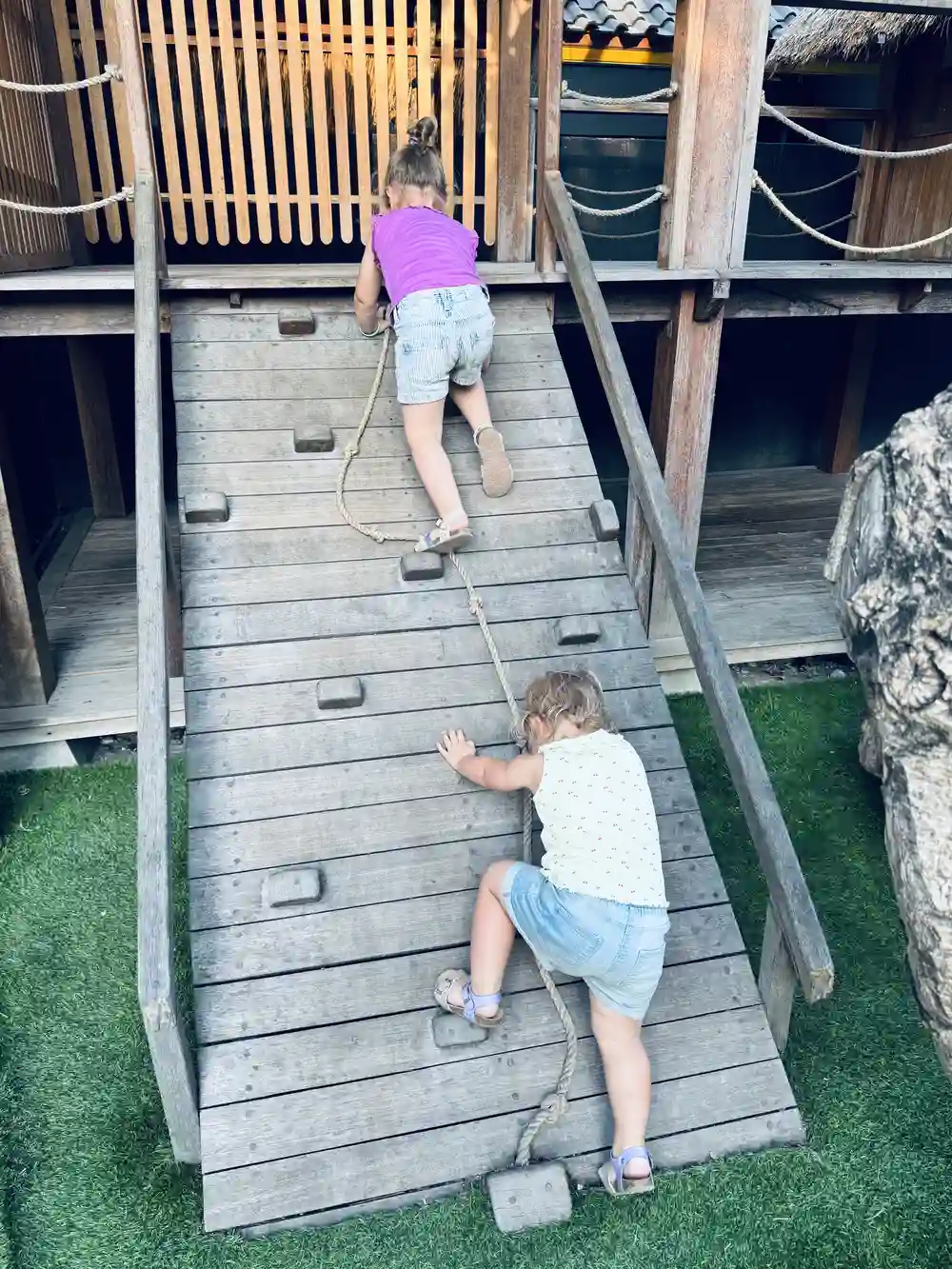 Kids playing on the playground at Ohana's Beachfront Resort in Nusa Lembongan